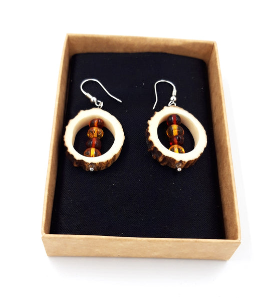 Earrings made of deer horn and amber
