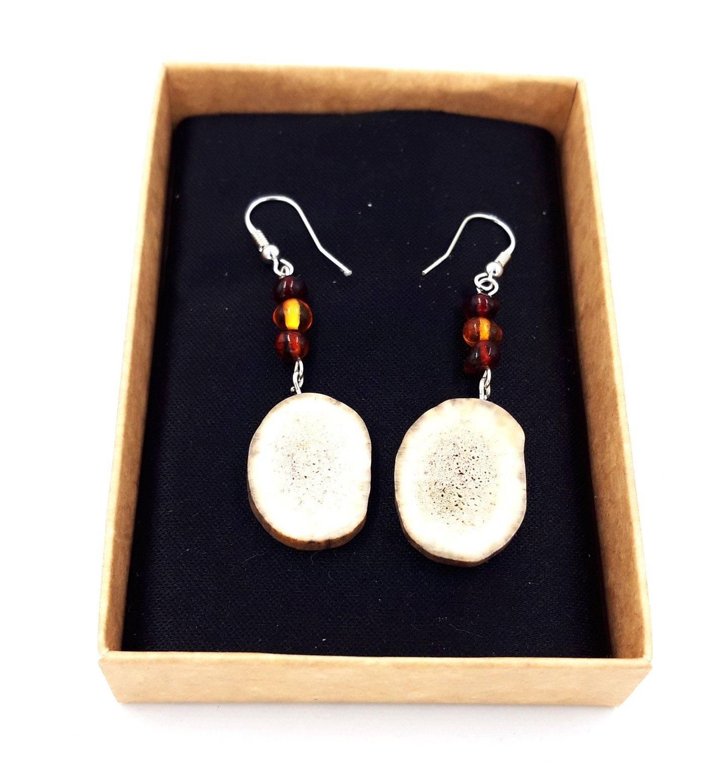Earrings made of deer horn and amber