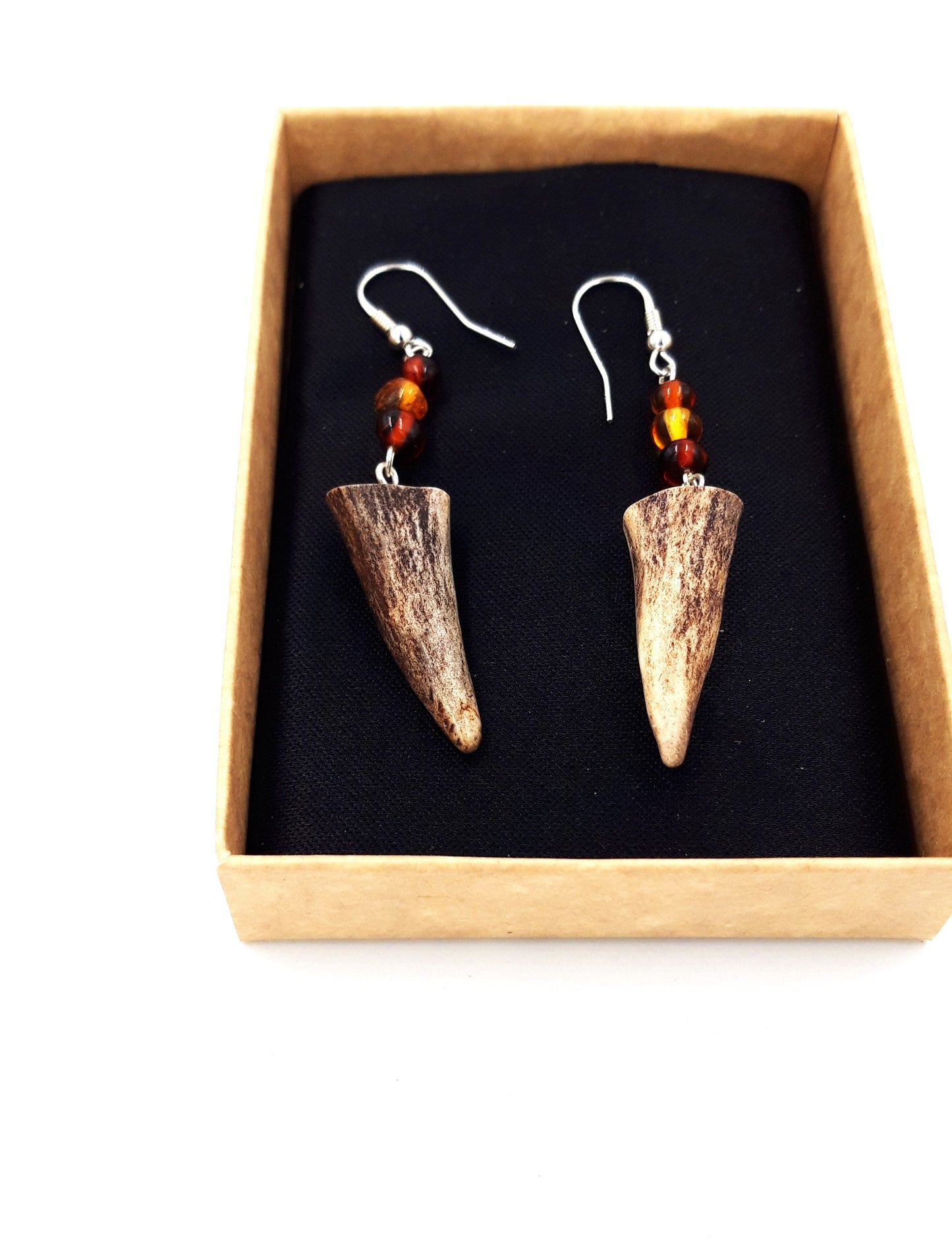 Earrings made of doe's horn and amber